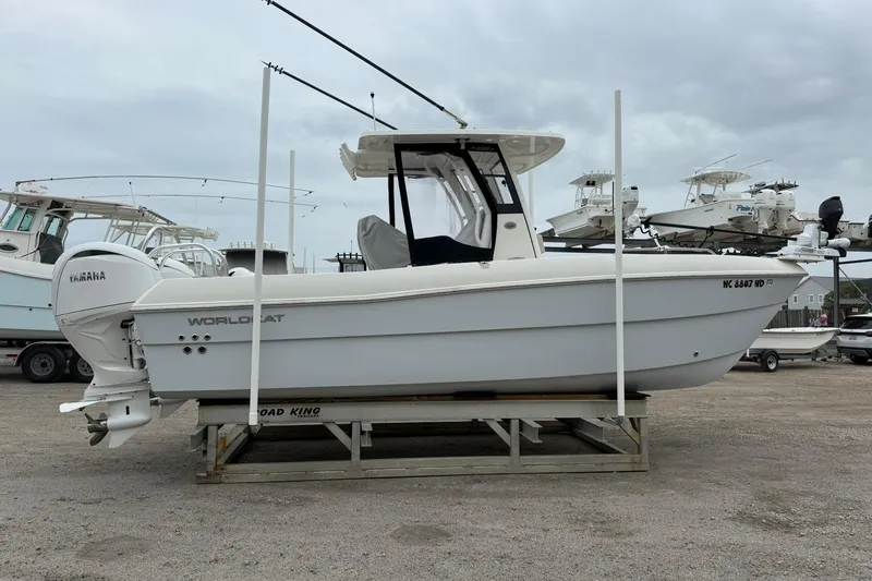 Slide: The Image of 2025 World Cat 235 TE boat with Yamaha engine on a trailer in a marina. - 4