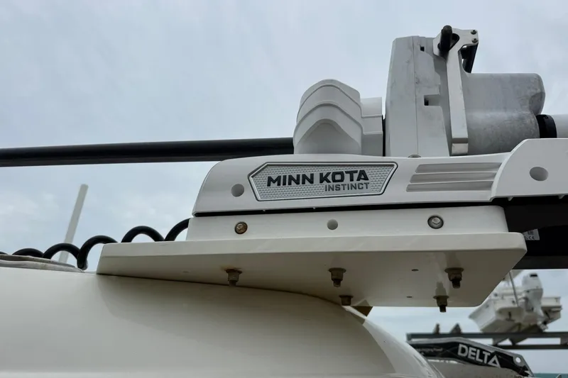 Slide: The Image of Minn Kota Instinct motor on 2025 World Cat 235 TE boat, close-up view. - 6