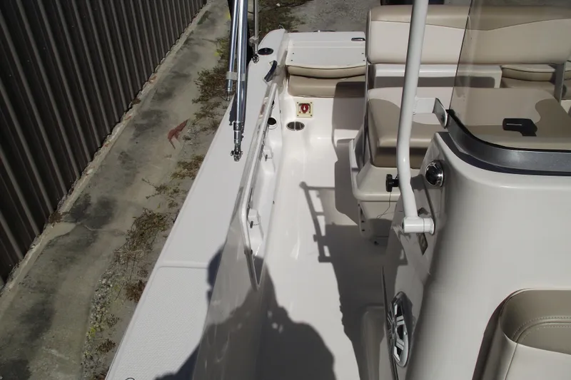 Slide: The Image of 2017 Robalo R160 Center Console boat interior with seating and console details. - 11