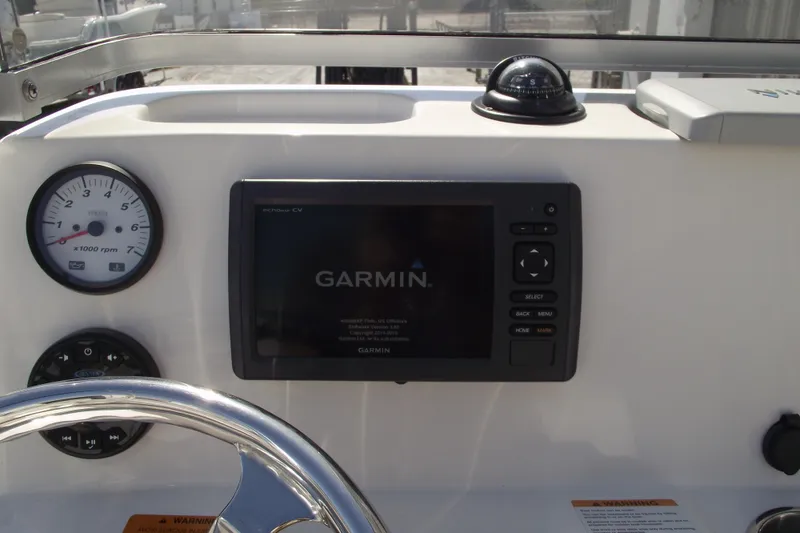 Slide: The Image of 2017 Robalo R160 Center Console dashboard with Garmin GPS and Yamaha tachometer. - 16