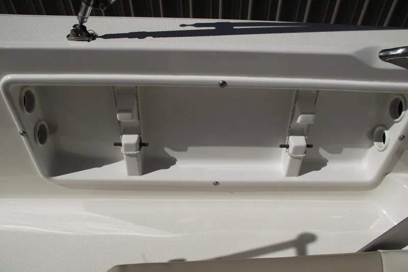 Slide: The Image of 2017 Robalo R160 Center Console boat storage compartment detail. - 17