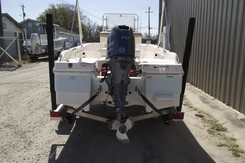 Slide: The Image of 2017 Robalo R160 Center Console boat with Yamaha 70 outboard motor, parked outdoors. - 3