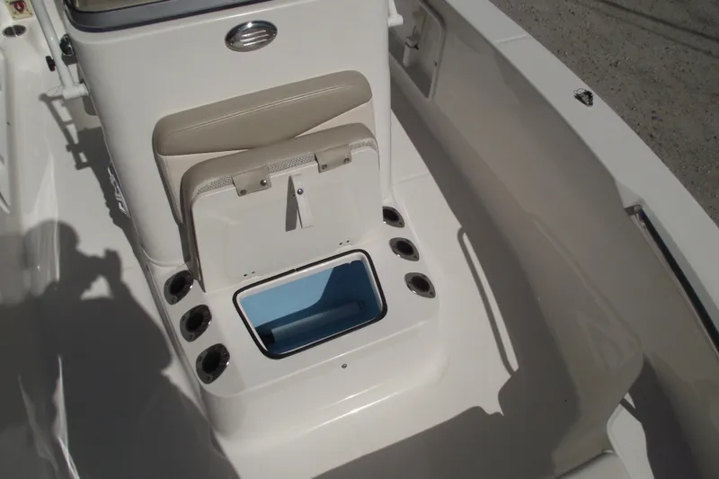 Slide: The Image of 2017 Robalo R160 Center Console boat interior with open storage compartment. - 9