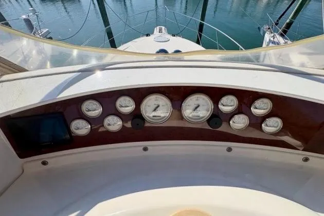 Slide: The Image of Dashboard of a 2008 Silverton 36 Convertible yacht with gauges and controls. - 11