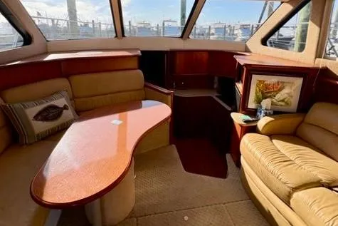 Slide: The Image of 2008 Silverton 36 Convertible yacht interior with plush seating and elegant wood finishes. - 21