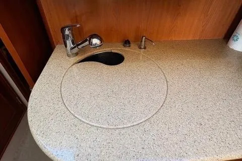 Slide: The Image of 2008 Silverton 36 Convertible yacht kitchen sink with faucet and countertop. - 26