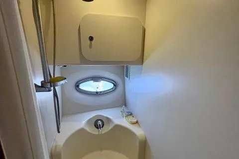 Slide: The Image of Bathroom interior of 2008 Silverton 36 Convertible yacht with shower and porthole window. - 30