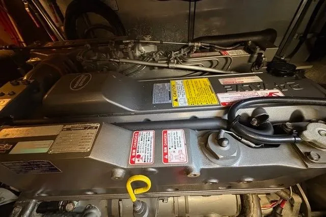 Slide: The Image of Engine compartment of a 2008 Silverton 36 Convertible boat, showcasing detailed components and labels. - 34