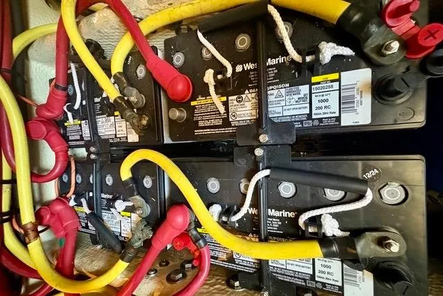 Slide: The Image of Battery setup in a 2008 Silverton 36 Convertible boat with red and yellow cables. - 36