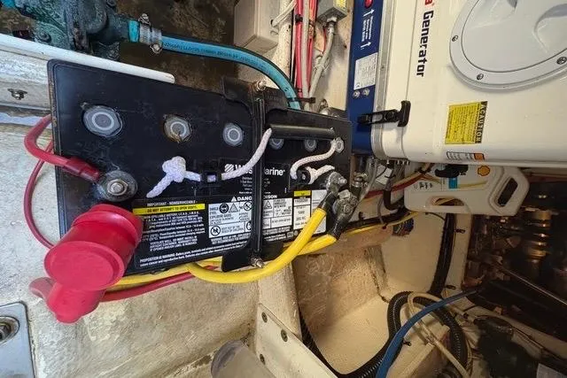 Slide: The Image of Battery and generator setup in a 2008 Silverton 36 Convertible boat. - 37