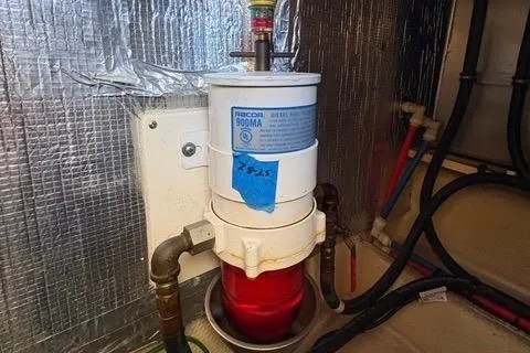 Slide: The Image of Fuel filter system in a 2008 Silverton 36 Convertible boat engine room. - 38