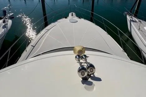 Slide: The Image of 2008 Silverton 36 Convertible yacht bow with sunlight reflecting on water. - 4