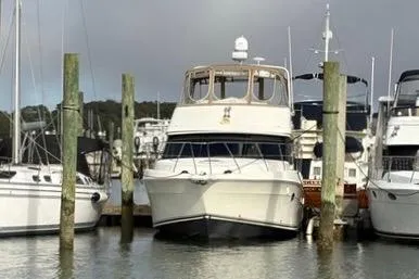 Slide: The Image of 2008 Silverton 36 Convertible yacht docked at a marina. - 40