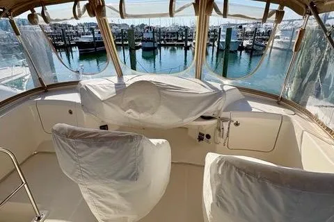 Slide: The Image of 2008 Silverton 36 Convertible yacht cockpit with marina view. - 7