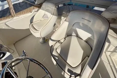 Slide: The Image of 2008 Silverton 36 Convertible boat interior with two white captain's chairs. - 8