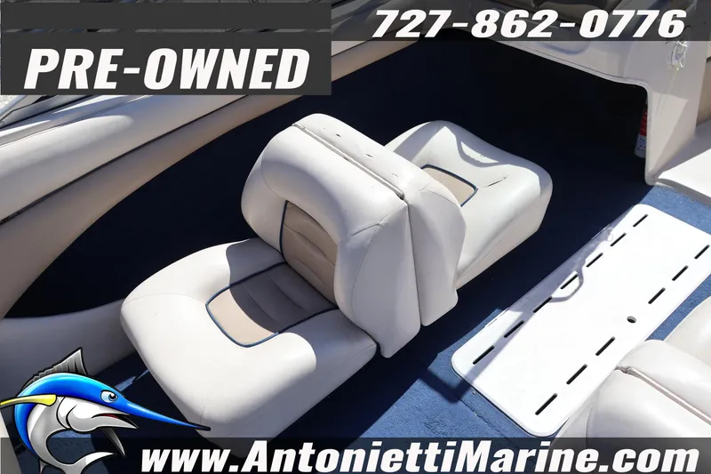 Slide: The Image of Pre-owned 1997 Glastron boat interior with white seating, available at Antonietti Marine. - 11