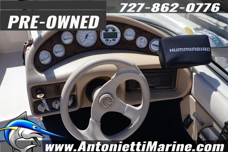 Slide: The Image of Pre-owned 1997 Glastron boat dashboard with Humminbird device and gauges. - 13