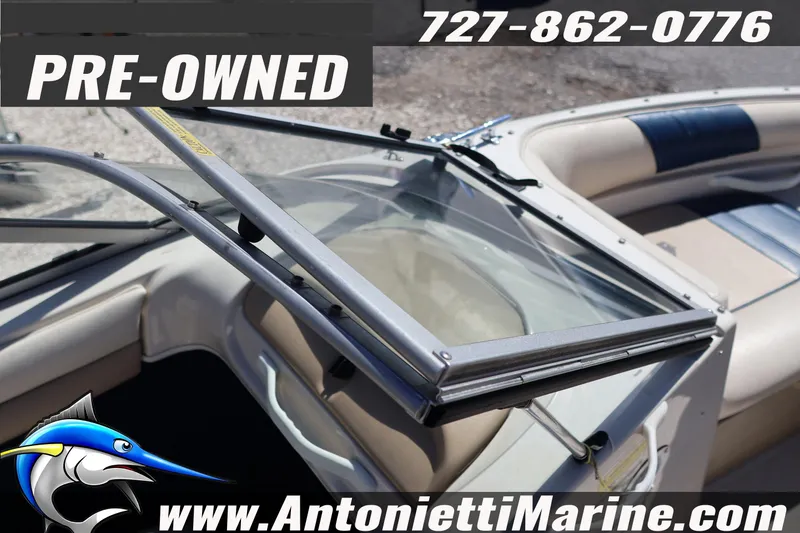 Slide: The Image of Pre-owned 1997 Glastron boat interior with open windshield, available at Antonietti Marine. - 18