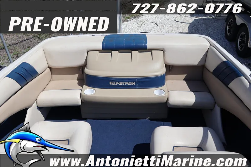 Slide: The Image of Pre-owned 1997 Glastron SX 175 boat interior with beige and blue seating. - 26