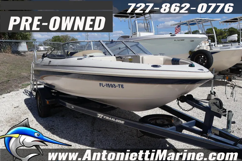 Slide: The Image of Pre-owned 1997 Glastron boat on trailer at Antonietti Marine dealership. - 3