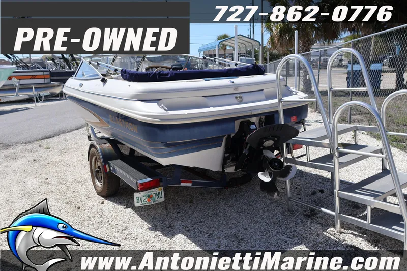 Slide: The Image of Pre-owned 1997 Glastron boat on trailer at Antonietti Marine dealership. - 4
