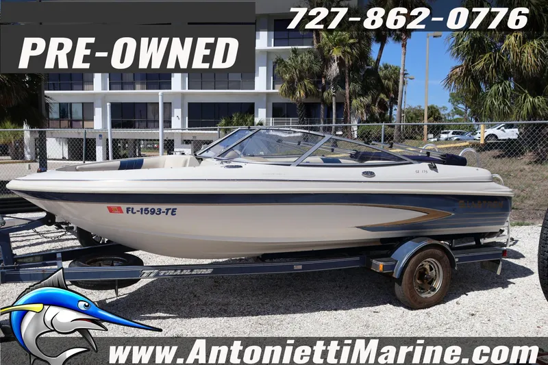 Slide: The Image of Pre-owned 1997 Glastron boat on trailer, displayed at Antonietti Marine dealership. - 5