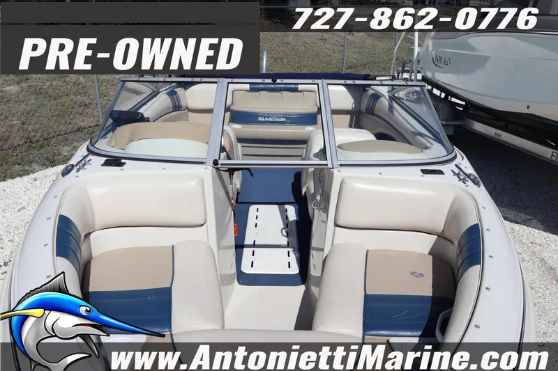 Slide: The Image of Pre-owned 1997 Glastron boat with beige and blue seating, available at Antonietti Marine. - 6