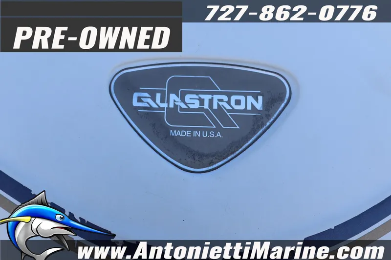 Slide: The Image of Pre-owned 1997 Glastron boat emblem with contact details and website. - 7