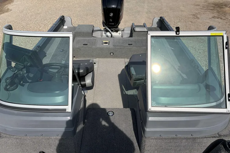 Slide: The Image of 2016 Lund 1675 Impact boat interior with dual windshields and steering console. - 7