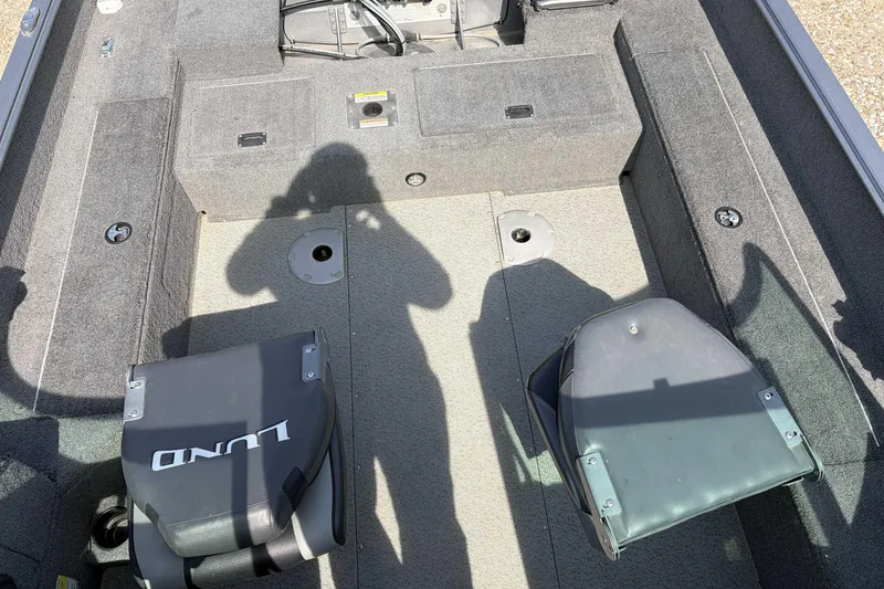 Slide: The Image of 2016 Lund 1675 Impact boat interior with seating and storage compartments. - 8