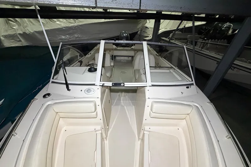 Slide: The Image of 2020 Grady White Freedom 192 boat interior with seating and windshield in storage. - 14
