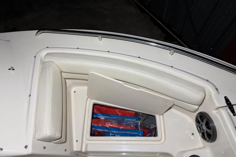 Slide: The Image of 2020 Grady White Freedom 192 boat interior with storage compartment and speaker. - 16