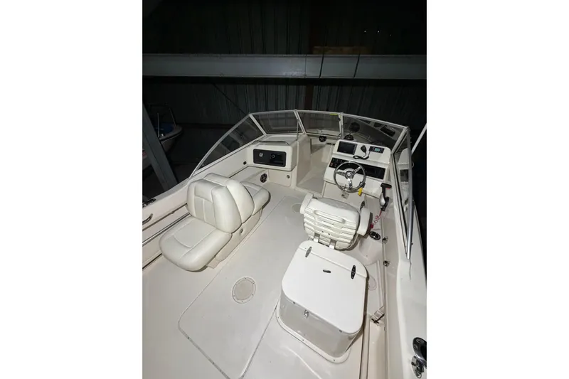 Slide: The Image of 2020 Grady White Freedom 192 boat interior with seating and steering console. - 19