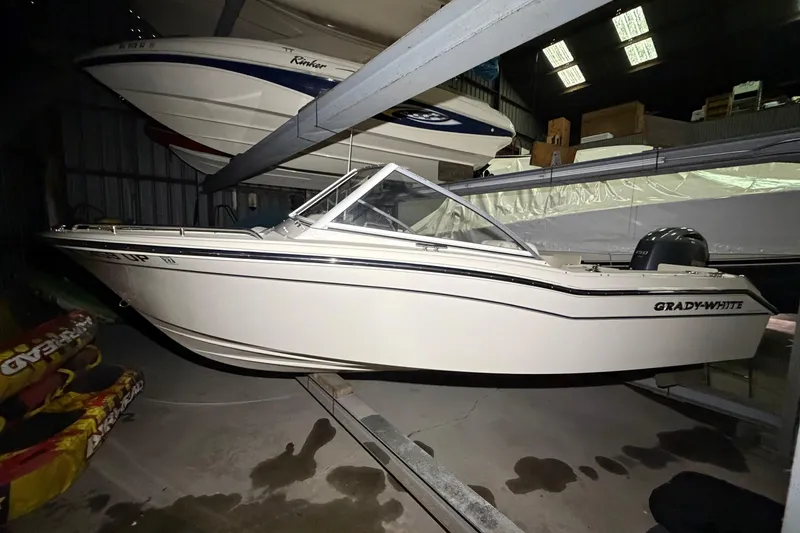 Slide: The Image of 2020 Grady-White Freedom 192 boat in storage, side view, indoors. - 3