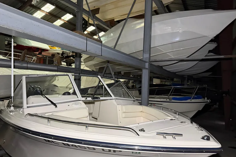 Slide: The Image of 2020 Grady White Freedom 192 boat stored in a warehouse with other vessels. - 4