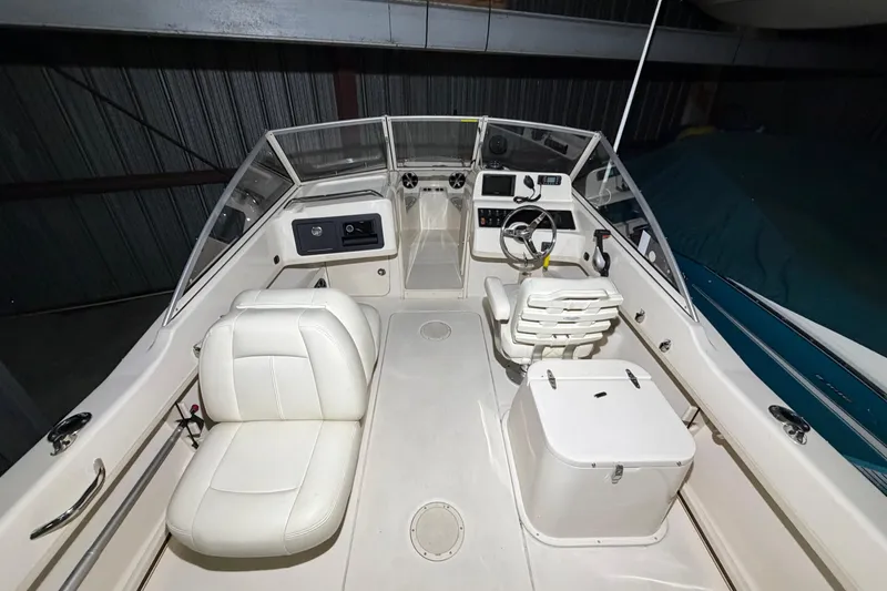 Slide: The Image of 2020 Grady White Freedom 192 boat interior with steering wheel and seating. - 7