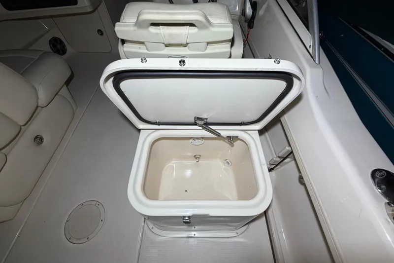 Slide: The Image of Open storage compartment on 2020 Grady White Freedom 192 boat interior. - 8