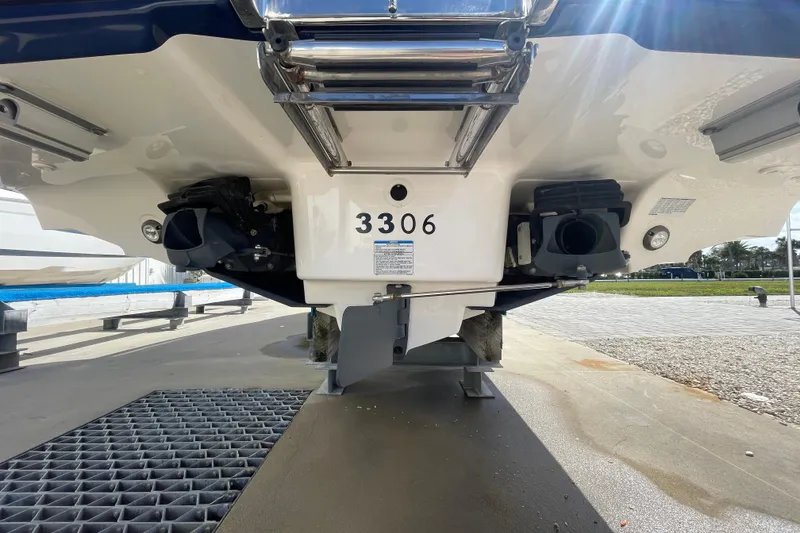 Slide: The Image of Rear view of 2021 Yamaha Boats 275SE, showcasing dual jet propulsion system. - 23