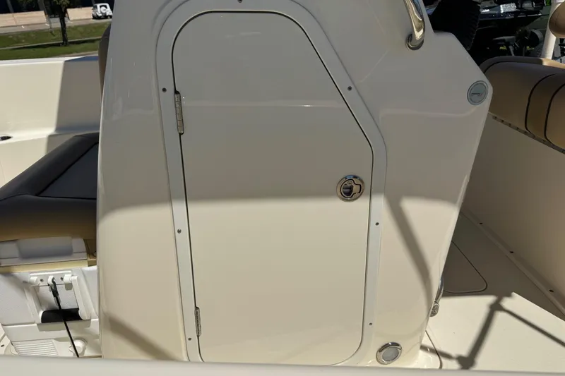 Slide: The Image of 2018 Scout 195 Sportfish boat interior with storage compartment and seating. - 12