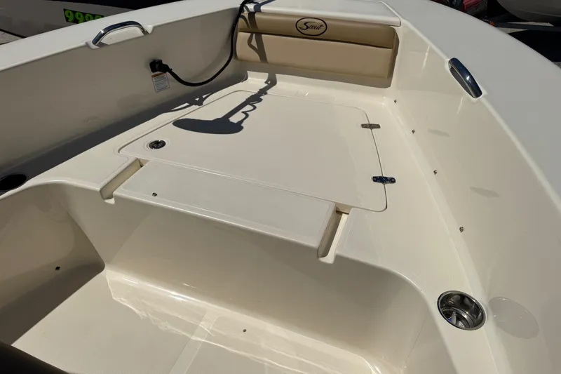 Slide: The Image of 2018 Scout 195 Sportfish boat interior with seating and storage compartment. - 23
