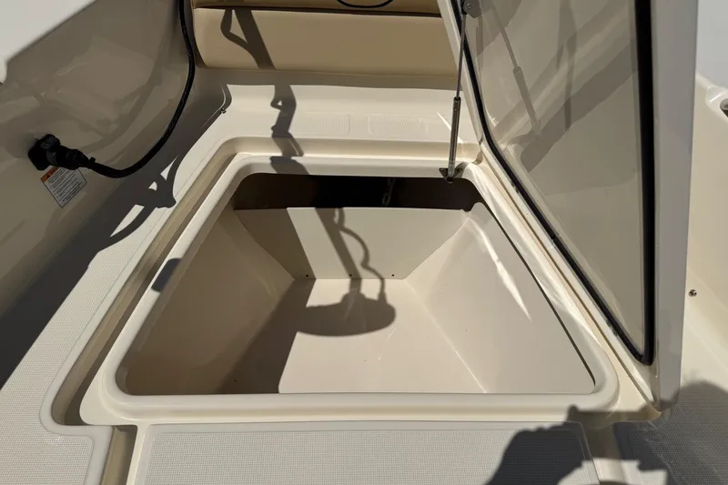 Slide: The Image of Open storage compartment on a 2018 Scout 195 Sportfish boat. - 24