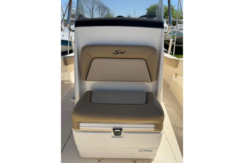 Slide: The Image of 2018 Scout 195 Sportfish boat seat with tan upholstery and storage compartment. - 25