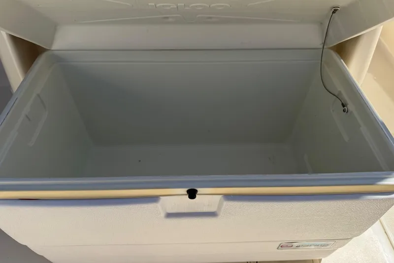 Slide: The Image of Open Igloo cooler on 2018 Scout 195 Sportfish boat, showcasing spacious interior. - 26