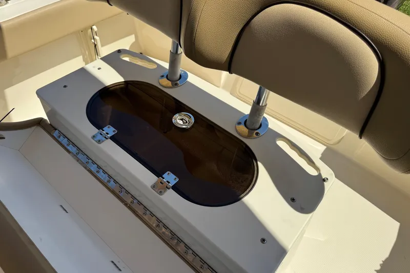 Slide: The Image of 2018 Scout 195 Sportfish boat interior with seating and storage compartment. - 28