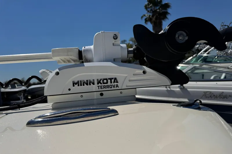 Slide: The Image of Minn Kota Terrova motor on 2018 Scout 195 Sportfish boat, sunny marina background. - 3