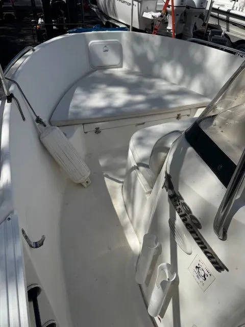 Slide: The Image of Interior of a 2003 Wellcraft Tournament boat, white upholstery and seating area. - 6