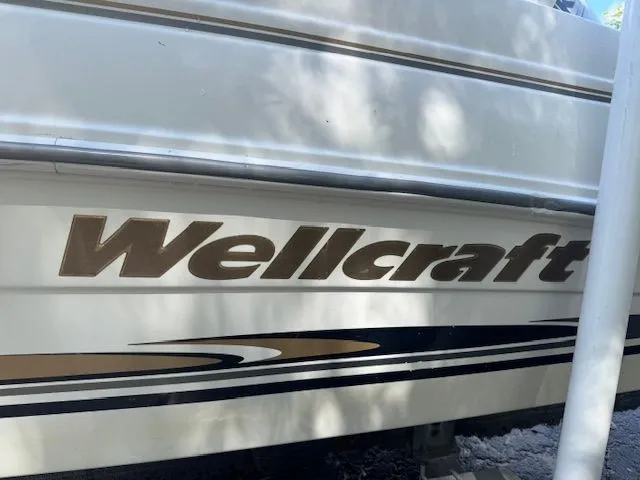 Slide: The Image of 2003 Wellcraft Tournament boat with logo and stripes. - 9