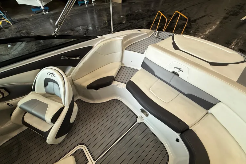 Slide: The Image of 2016 Monterey 224FS boat interior with sleek seating and modern design. - 10