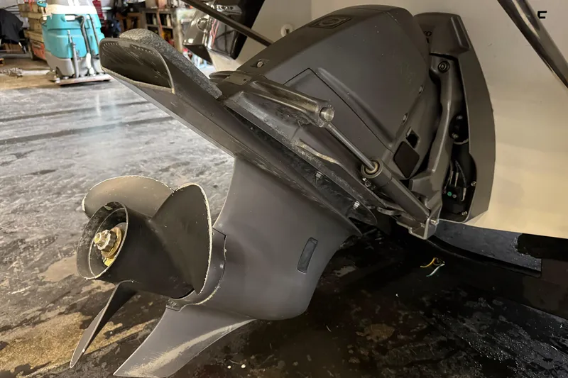 Slide: The Image of Close-up of a 2016 Monterey 224FS boat's outboard motor and propeller in a garage. - 18
