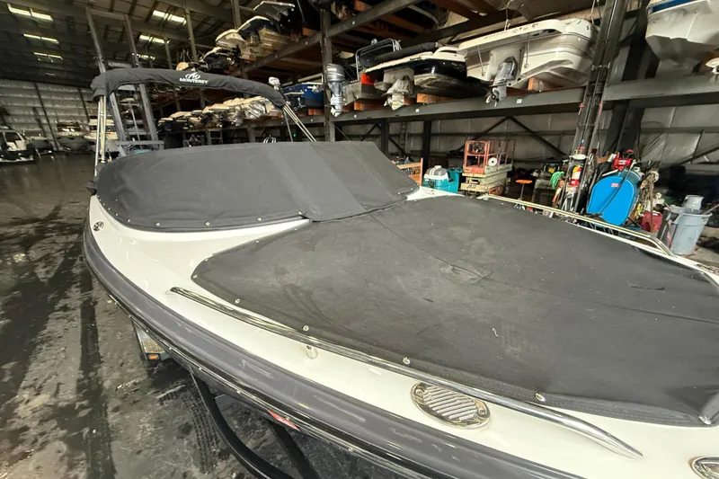 Slide: The Image of 2016 Monterey 224FS boat with cover in indoor storage facility. - 21